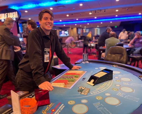 A dealer smiling in casino